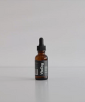 Brown glass dropper bottle with a label on a white background