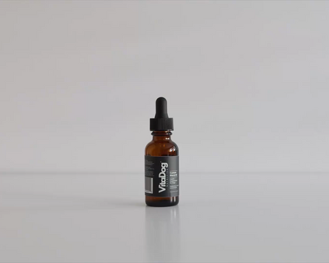 Brown glass dropper bottle with a label on a white background